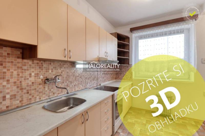 The kitchen of a 3-room apartment with light furniture and mosaic tiles.