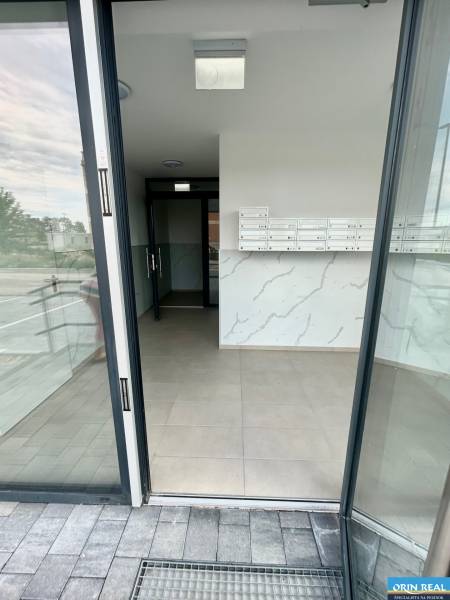 Entrance area with mailboxes in the building on Dúhová Street in Slovenský Grob.