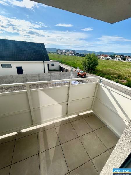 The balcony of a 3-room apartment on Dúhová Street in Slovenský Grob with a view of the surroundings.