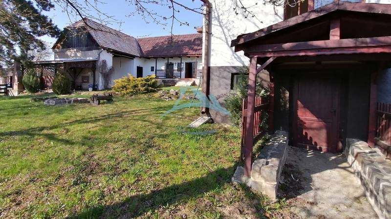 Garden, family house, seating area, lawn, wooden shelter, sunlight.