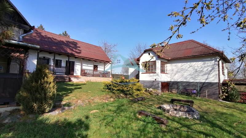 A family house with a garden and a fire pit in the yard, ideal for relaxation.