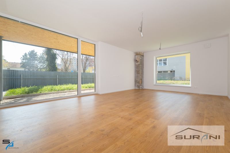 Spacious interior with wood-decor flooring and large windows, Family house.