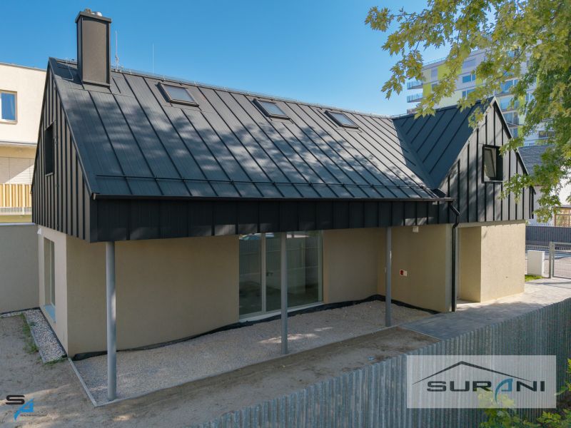 A family house on Železničná Street in Bratislava - Ružinov with a modern roof and fence.