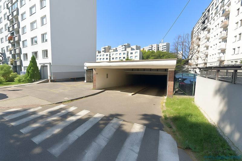 Entrance to the garages on Ondavská Street in Bratislava - Nivy surrounded by apartment buildings.