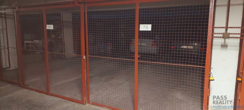 Garages with metal gates and cars in the background on Ondavská in Bratislava - Nivy.