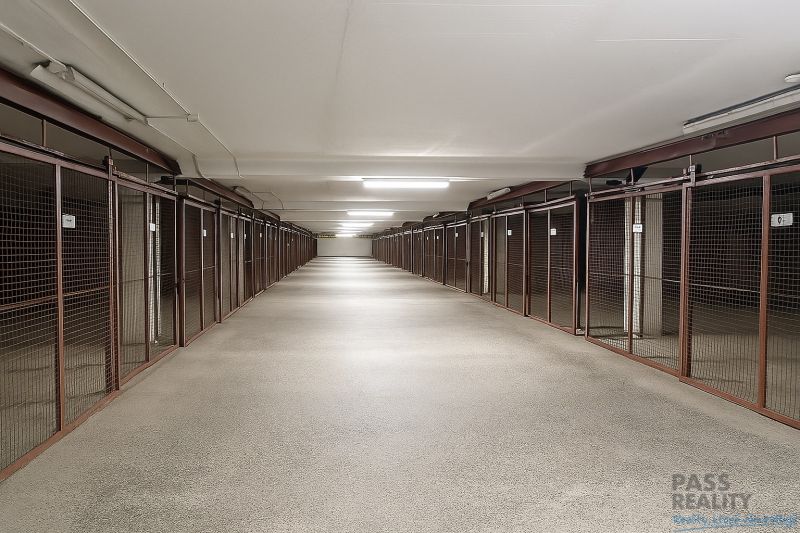 A long corridor with storage units in the Garages on Ondavská, Bratislava - Nivy.