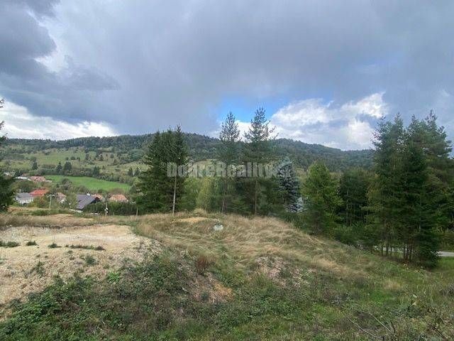 A view of residential plots in Kremnické Bane surrounded by nature and hills.