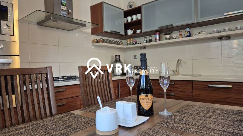 A kitchen in a family house with wooden decor and stylish equipment.
