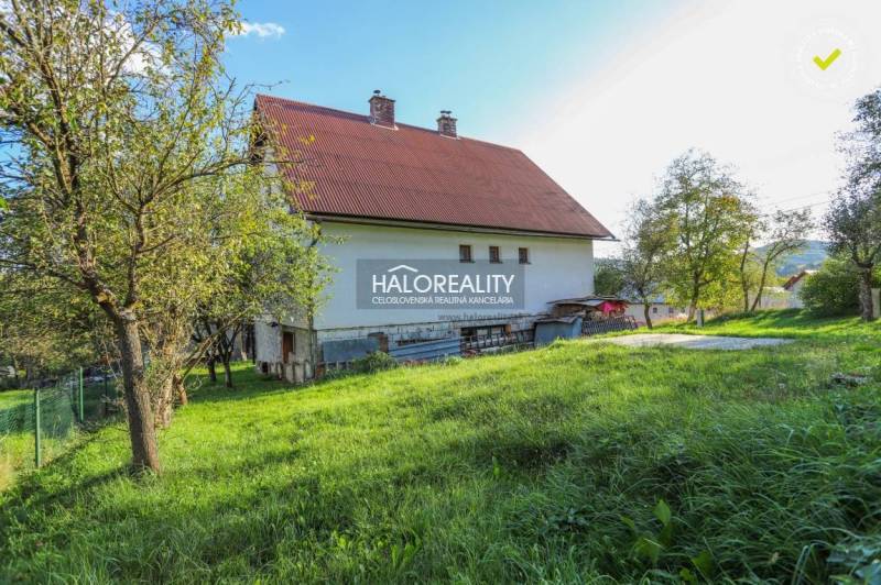 A family house in Papradno with a spacious garden and surrounding greenery.
