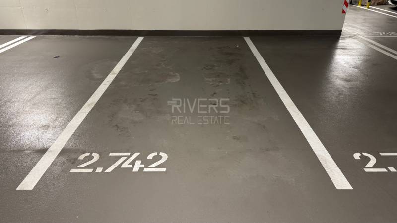 Parking space inside the Garage with number 2.742 and white lines.