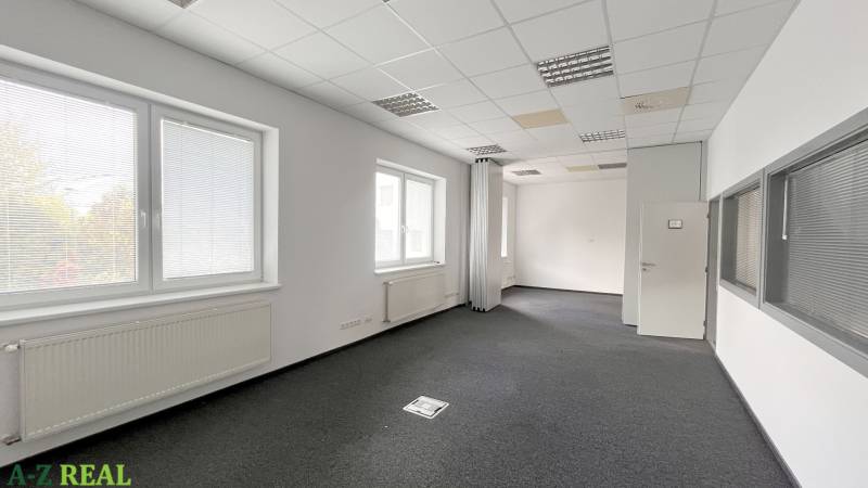 Offices with windows, carpeted floors, and white walls, suitable for administrative purposes.