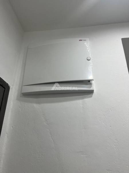 White electrical panel in a 3-room apartment.