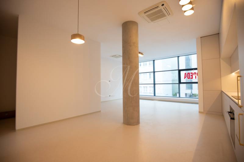 A bright room in a 4-room apartment with built-in wardrobes and large windows.