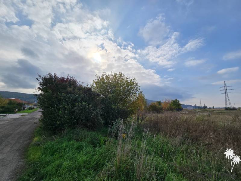 Plots - housing on Školská Street in Sokolovce with natural surroundings and sky.