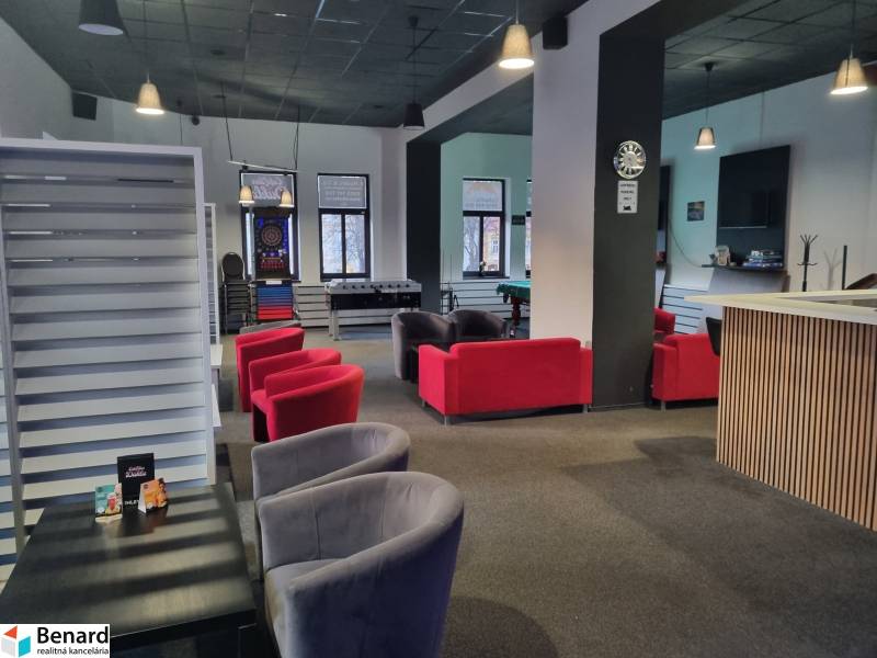 Commercial spaces with sofas and games, including table football and darts.