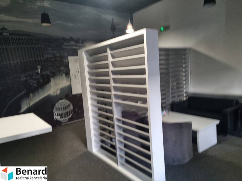 Interior with separate spaces and black-and-white wall decoration. Commercial premises.