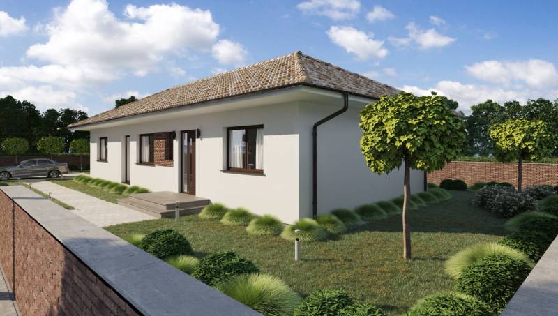 A family house in Gabčíkovo with a lawn, lined with trees and a path to the entrance.