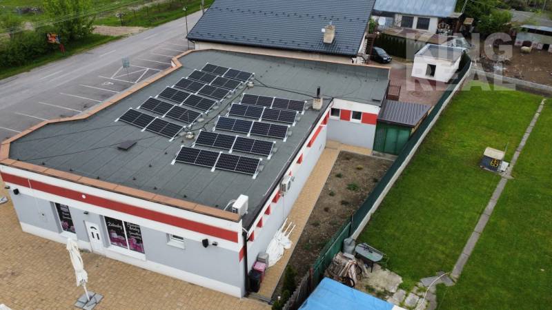 A building with solar panels on the roof at Štefánikova 267 in Palárikovo.