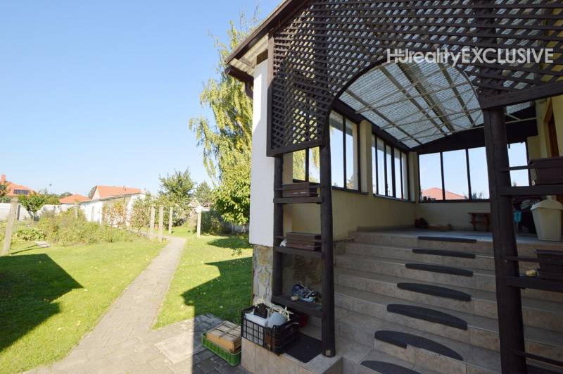 A family house in Hegyeshalom with a terrace and a landscaped garden.