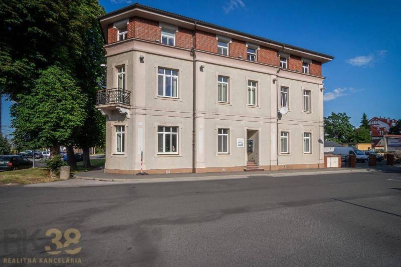 A building on Halatova Street in Poprad with a balcony and large windows.