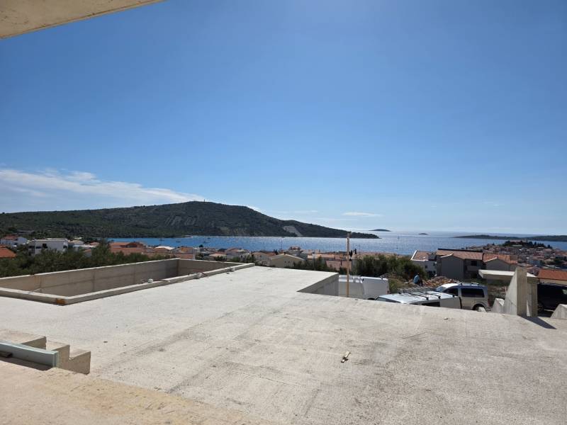 View from the terrace to the sea in Primošten, overlooking the rooftops and landscape.