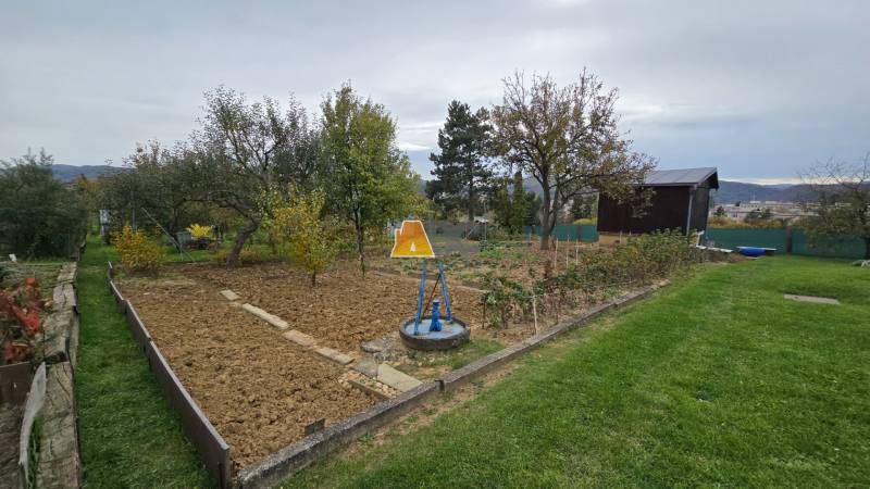 Gardens on A. Hlinka Street in Zvolen with plantings and a gazebo.