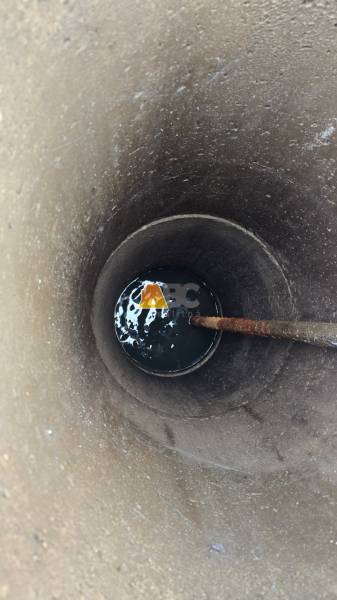 A view into the well with a water surface in the Gardens in the city of Zvolen on A. Hlinka Street.