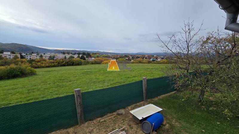 View of the green fields from the Gardens on A. Hlinka Street in Zvolen.