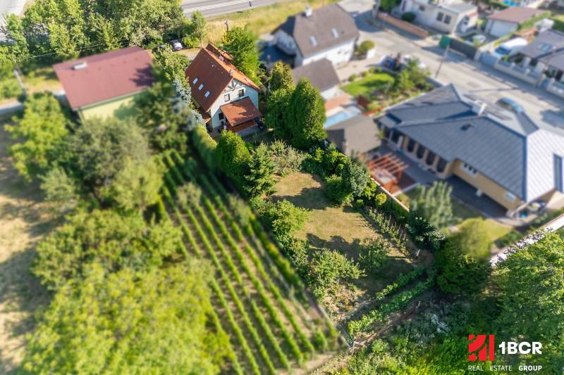 Aerial view of a family house with a garden on Senecká Street in Pezinok.