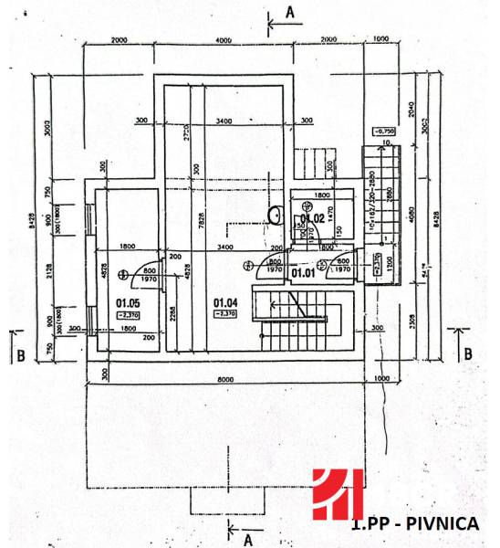 Basement floor plan of a family house with utility rooms and staircase.