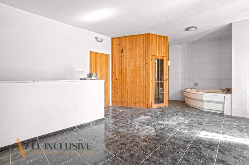 Commercial spaces with tiles, wooden sauna, reception desks, and a corner bathtub.