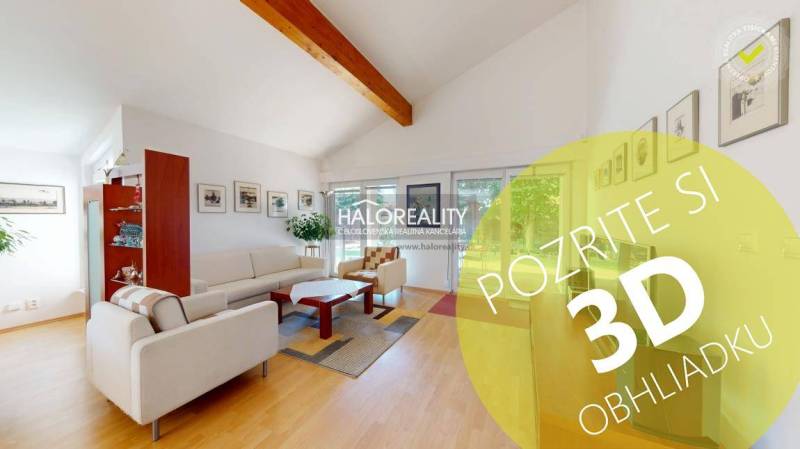 Living room in a family house with wood-patterned flooring, comfortable seating, and decorations.