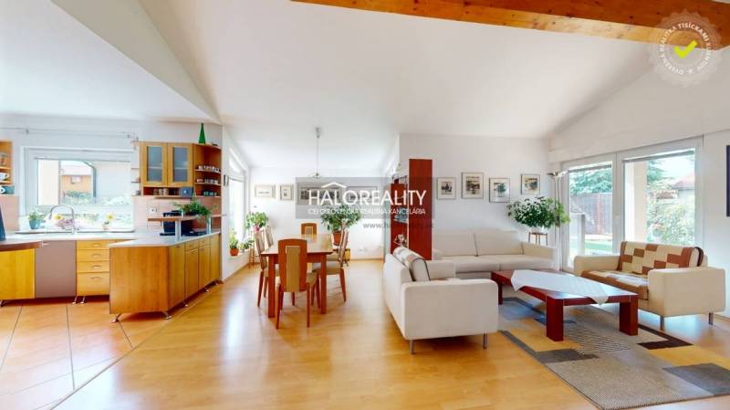 Open living space with wood-patterned flooring in a family house.