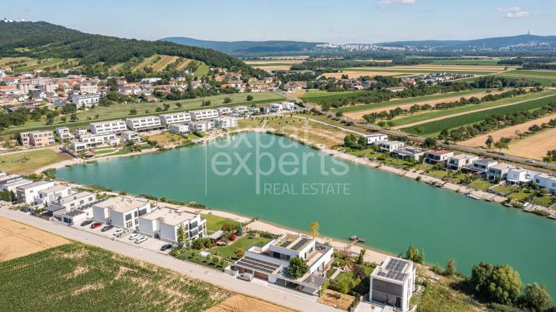Aerial view of a residential area by the lake in Kittsee, Am Strandbad, 4-room apartments.