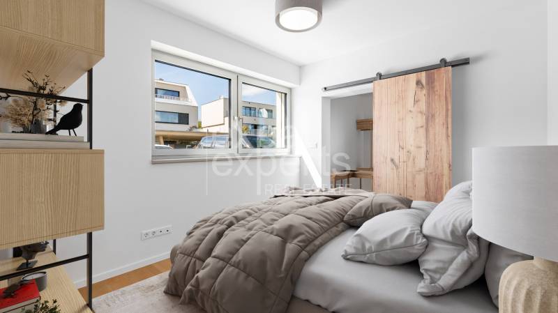 Bedroom with built-in wardrobe, wood-patterned flooring, and large window, 4-room apartment.