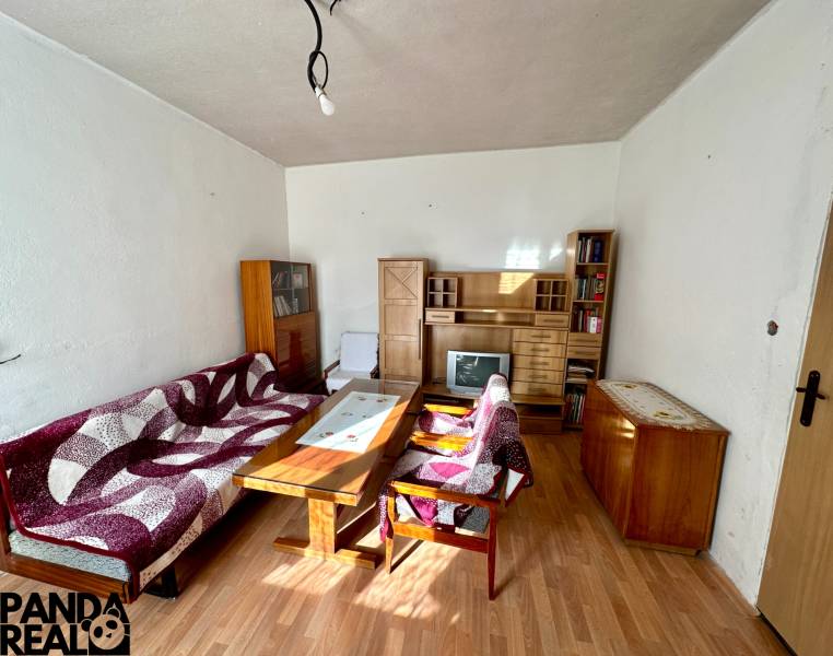 Living room in a family house with furniture and flooring with a wood decor.