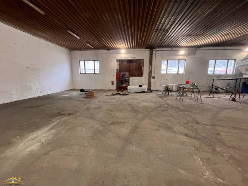 A view into the hall with a wooden decor ceiling in the warehouse complex in Olešná.