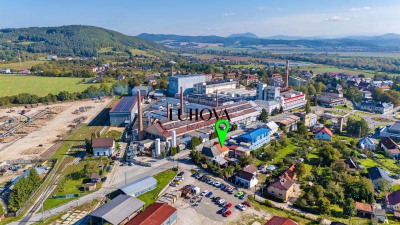 Aerial view of an industrial area with houses in Lednické Rovne on Sklárska Street.