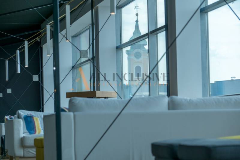 Interior seating with a view of the church, modern lighting, wooden decor flooring.