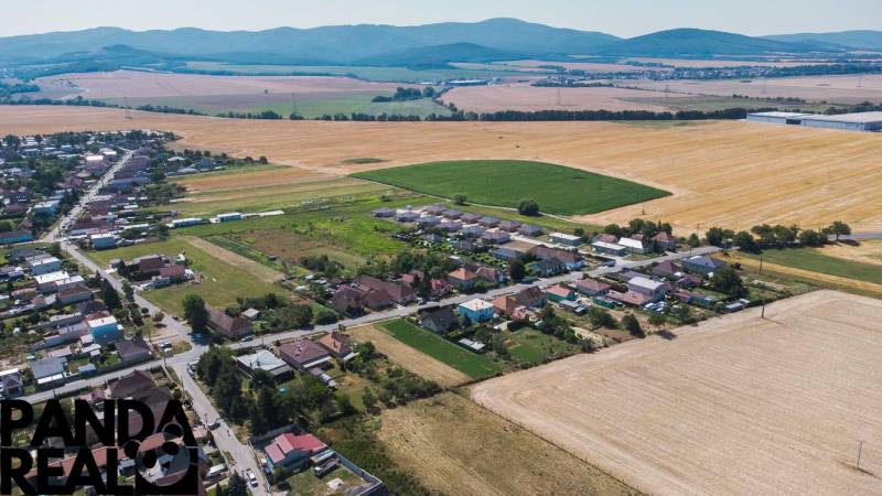 Aerial view of extensive residential plots in Práznovce with surrounding fields.
