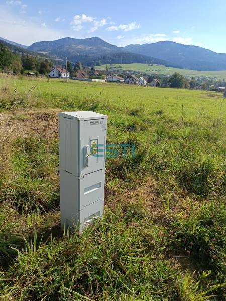 Plots - housing in Stránske on Stránska with an electrical cabinet, mountain panorama in the background.