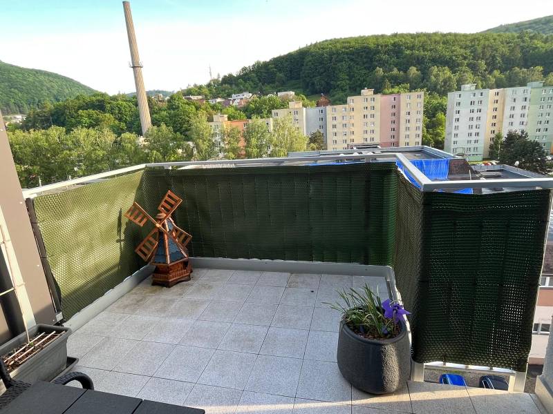 A balcony with a view of Trenčianske Teplice, buildings and greenery, Trenčianske Teplice, 2-room apartment.