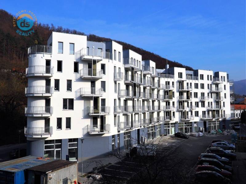A new apartment building on the street in Trenčianske Teplice with numerous balconies and parking space.