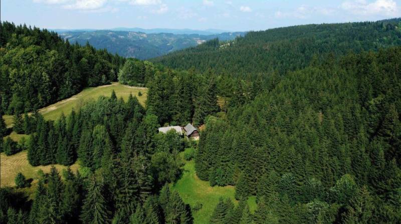 Wooded areas and meadows around Vysoká nad Kysucou, surrounded by agricultural and forest lands.