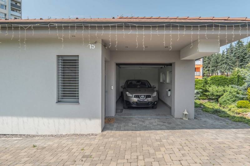 A family house on Janka Matúšku in Bánovce nad Bebravou with a garage and a car.