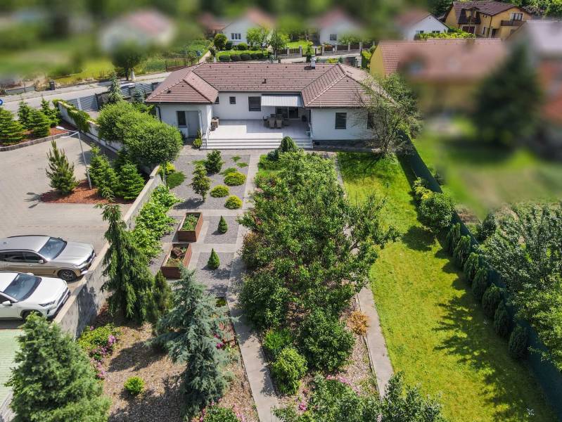 A family house in Bánovce nad Bebravou on Janka Matúšku Street with a landscaped garden and terrace.