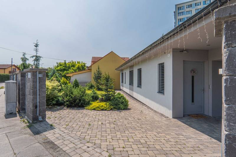 A family house on Janka Matúšku in Bánovce nad Bebravou with a paved courtyard and a garden.