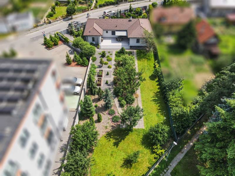 A family house on Janka Matúška Street in Bánovce nad Bebravou with a garden full of greenery.