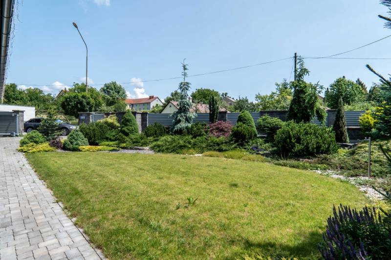The garden at the family house on Janka Matúška Street in Bánovce nad Bebravou with a manicured lawn.