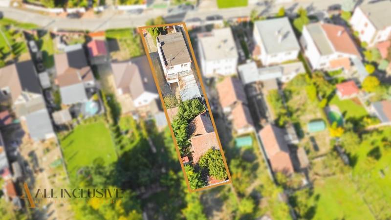 Aerial view of a family house in Veľká Mača with surroundings and greenery.